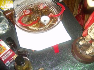 A court case spell in which opened handcuffs and other offerings represent a speedy conclusion to the client's troubles with the law.