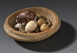 Wooden bowl containing shells, bones and nut kernels, South  Africa, 1890-1924, from the Science Museum of London